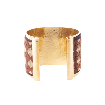 Back view of artisan gold plated cuff bracelet with reddish brown and tan embroidery design.