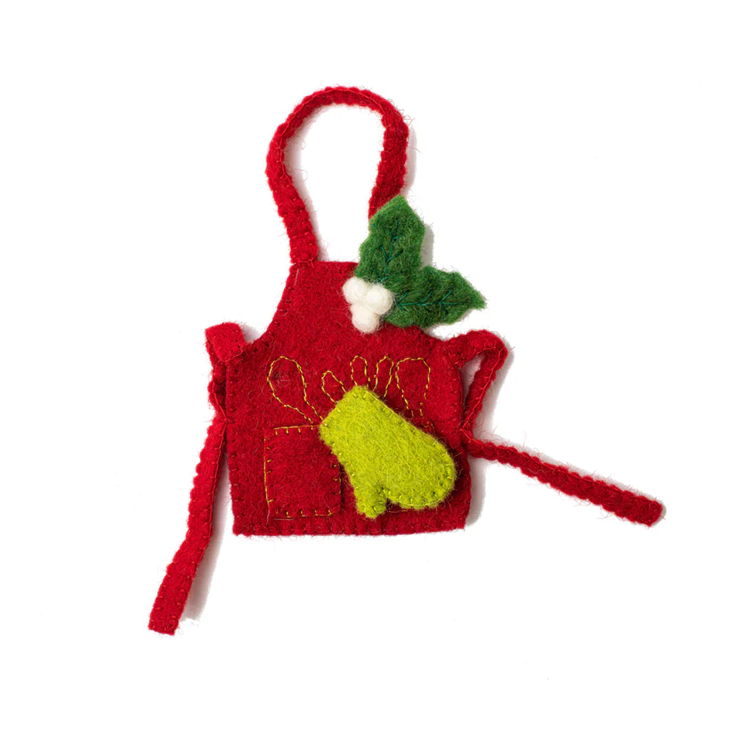 Felt ornament of a red apron with a green oven mitt and holiday greenery with white berries attached.