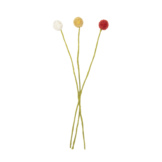 Three handmade beaded flowers with colorful petals on thin stems against a white background | Global Goods Partners