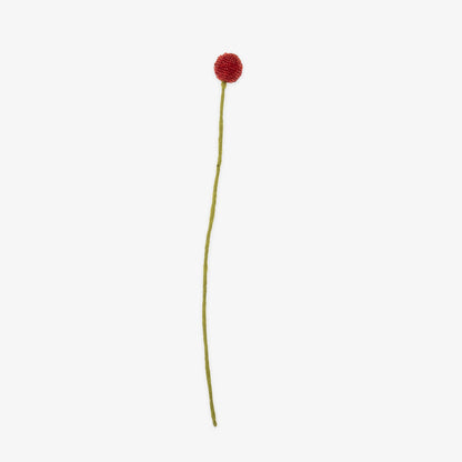 Single handmade red flower on a white background | Global Goods Partners