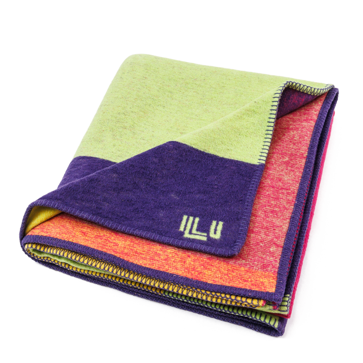 Blanket in bright purple, green, pink, and orange asymmetrical designs, folded neatly into a square.