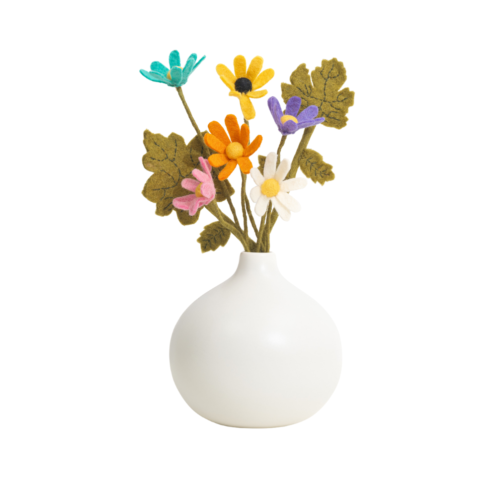 White vase with colorful felt flowers on a white background, all handmade | Global Goods Partners