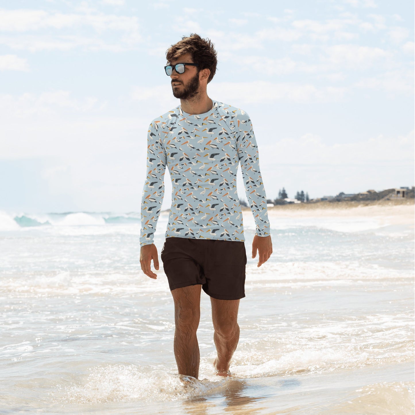 A long-sleeve pelican rash guard for men, featuring breathable fabric and a fun bird design for beach adventures.