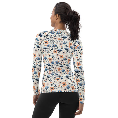 A women’s rash guard with a floral bloom design, made from sustainable fabric for comfort and outdoor versatility. Family matching
