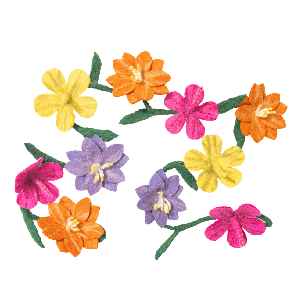 Handmade colorful floral garland on a white background fair trade and made by Nepali artisans | Global Goods Partners