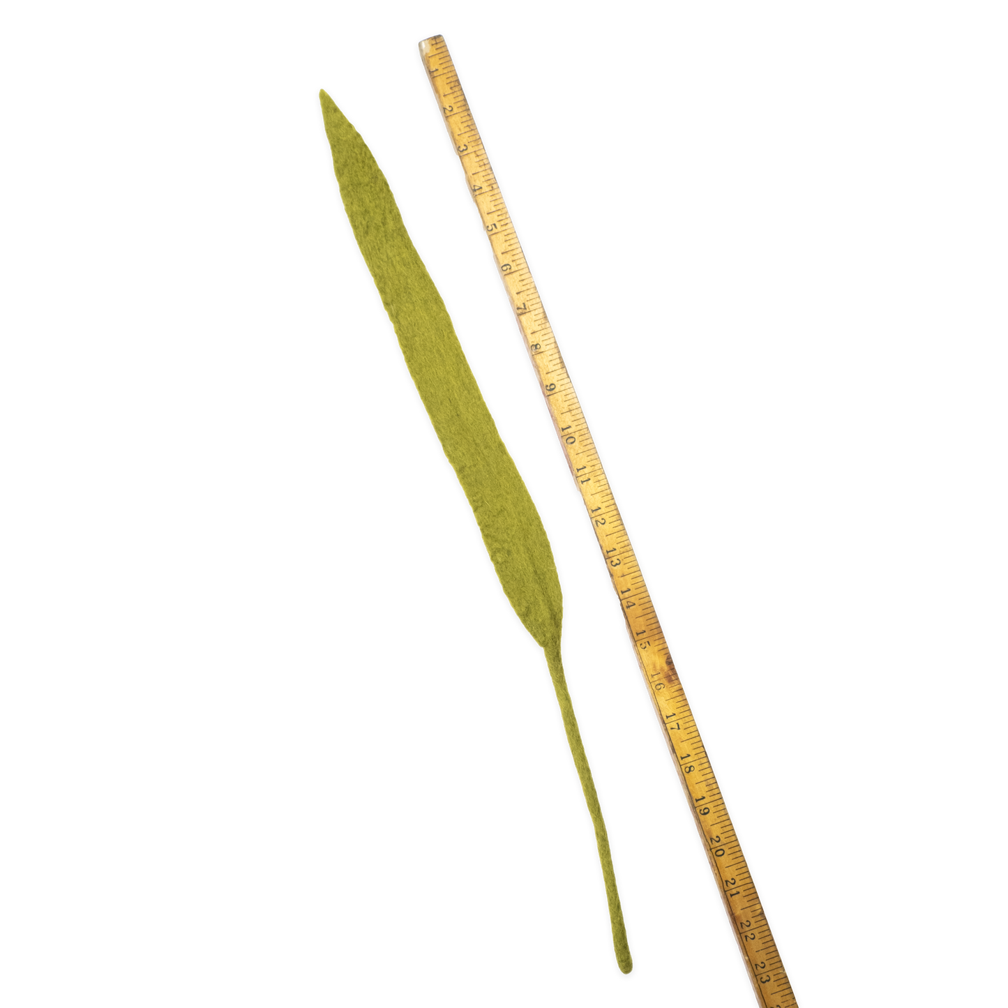 Fair trade felt green leaf next to a ruler on a white background | Global Goods Partners