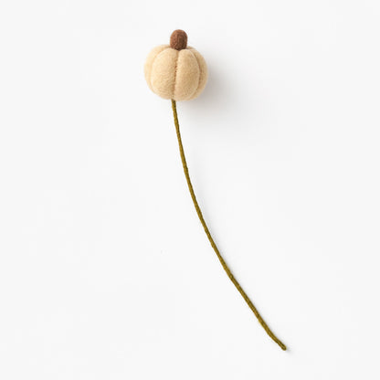 Handmade, artisan-made beige decorative pumpkin with a stem on a white background | Global Goods Partners