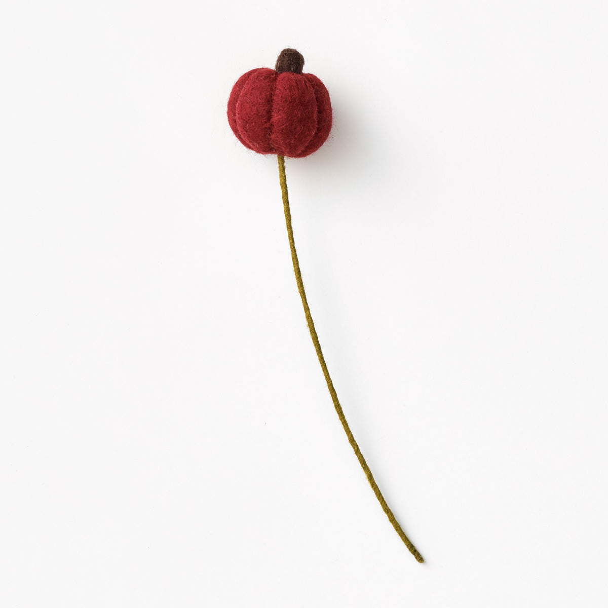 Red pumpkin flower accent on a green stem against a white background, made by women artisans in Nepal | Global Goods Partners