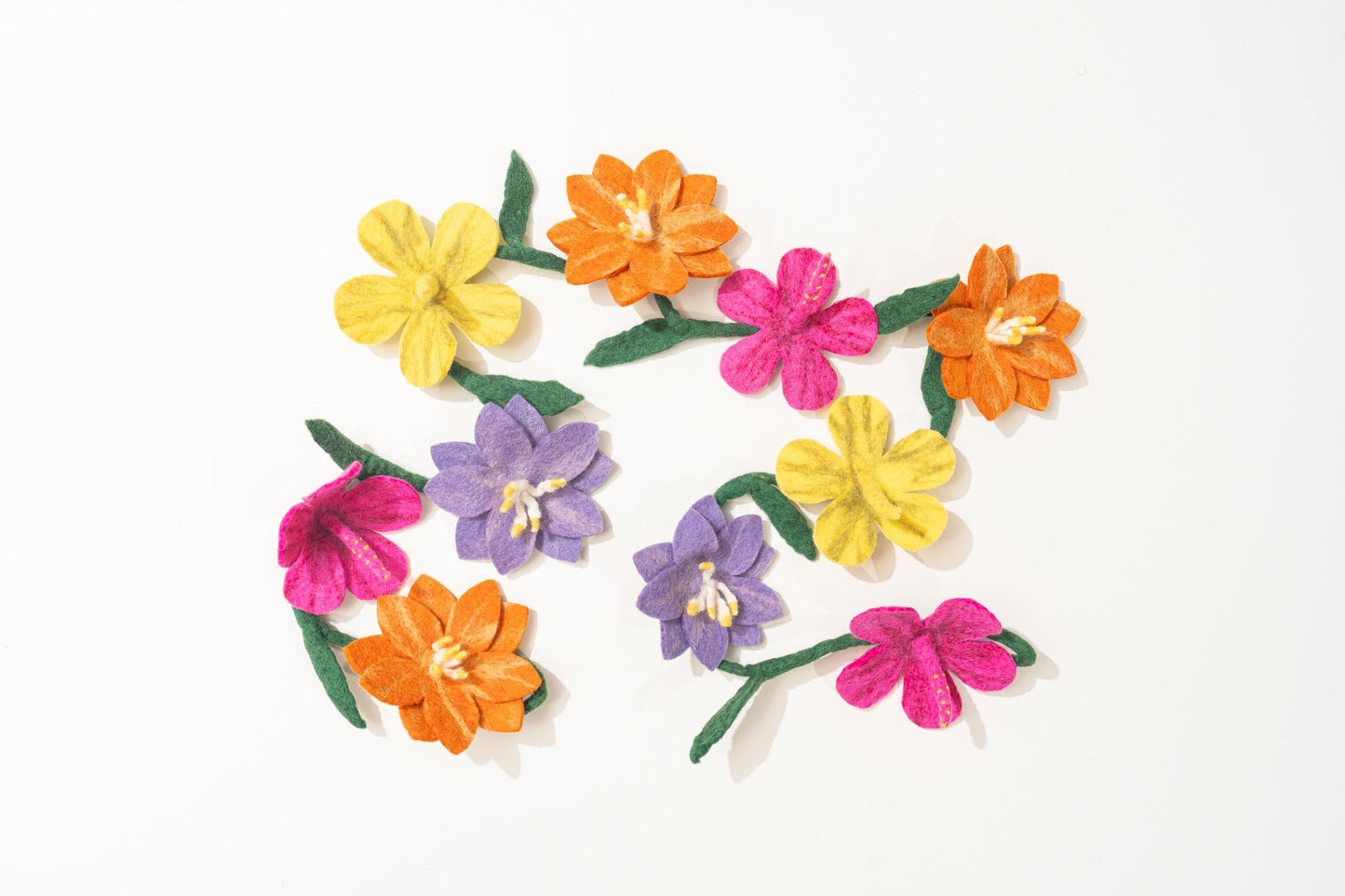 Colorful fair trade felt flower garland on a white background | Global Goods Partners
