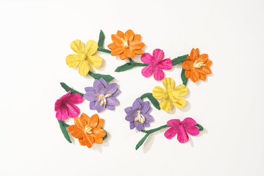 Colorful fair trade felt flower garland on a white background | Global Goods Partners
