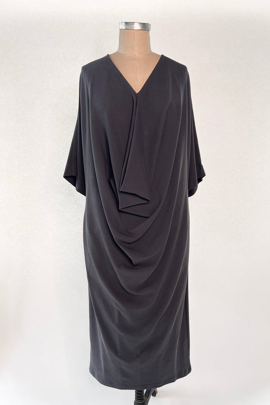 Knitted Orbis dress in iron color on mannikin.