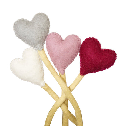 Felt heart accent stems in white, grey, pink, and red.
