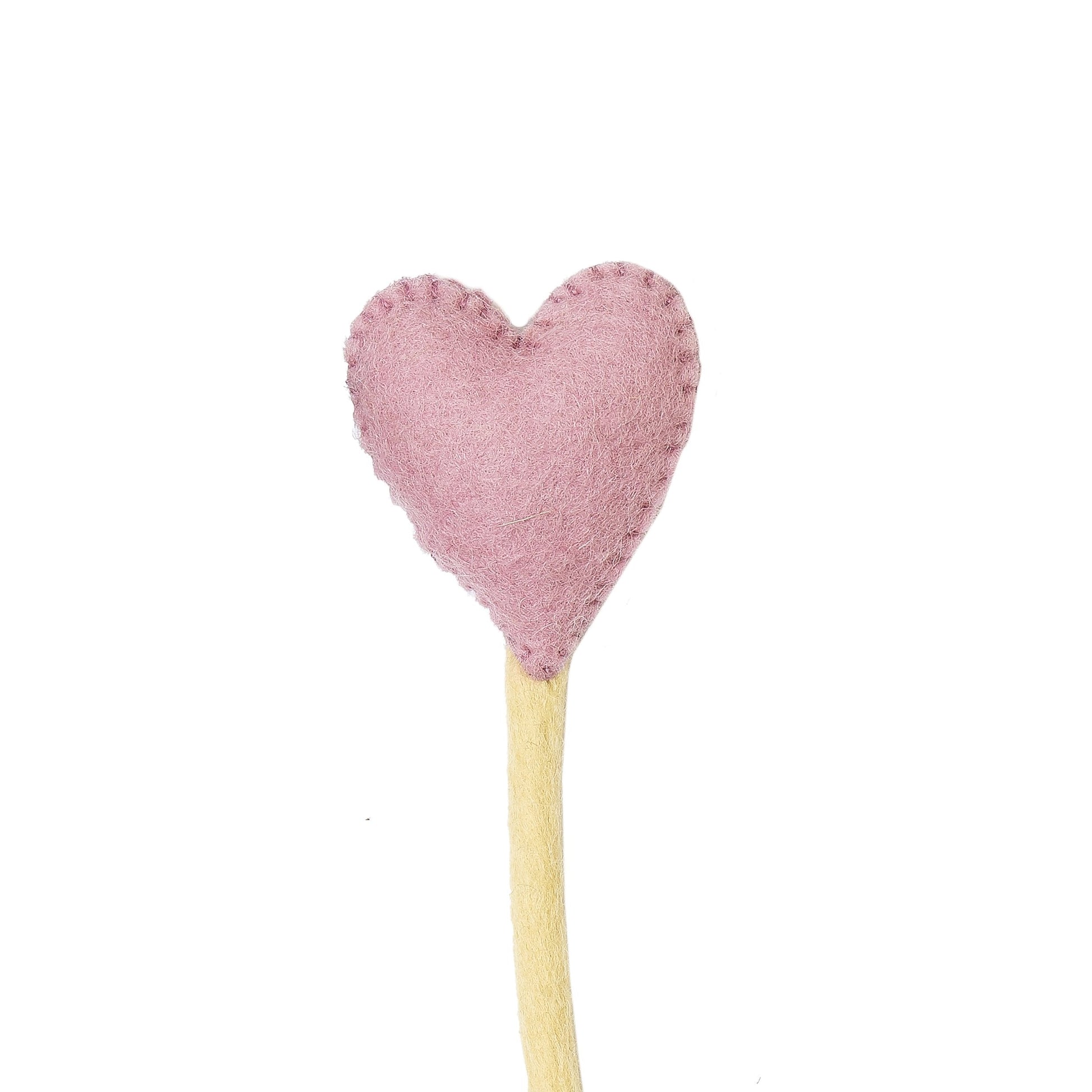 Close up of felt heart accent stem in pink.