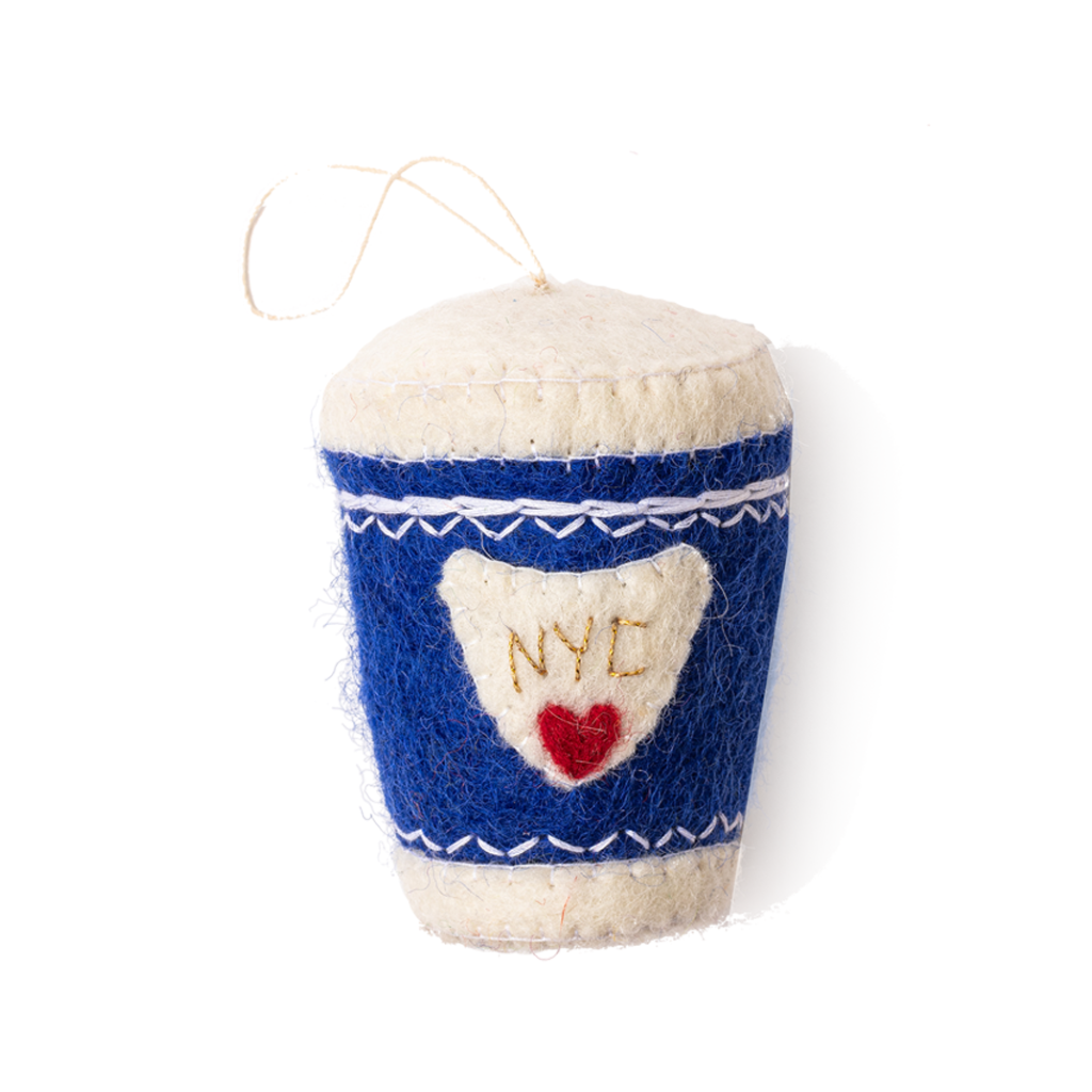 Felt ornament of a coffee cup with a blue sleeve that has NYC and a red heart on it.