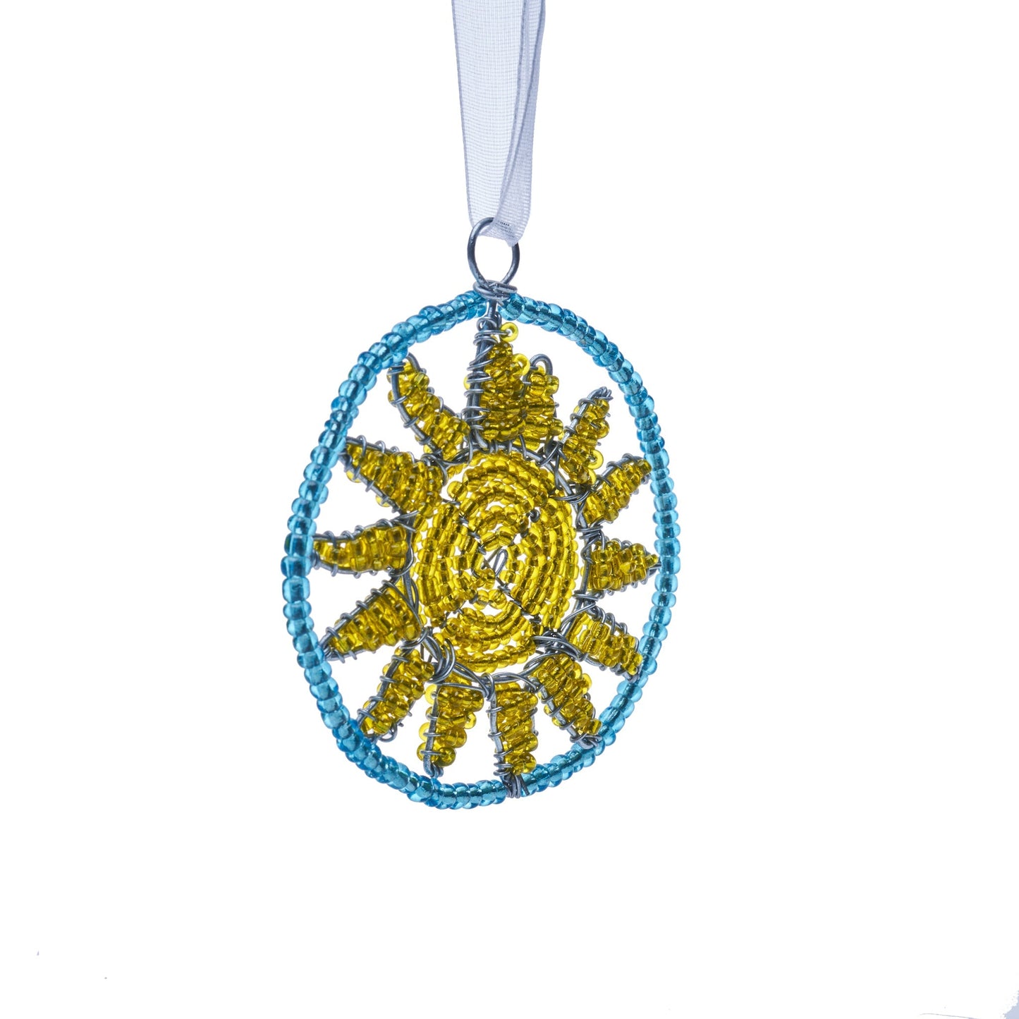 Beaded ornament of a yellow sun in a blue circle.