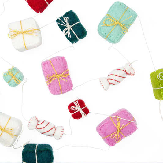 Felt garland of gifts in pink, teal, red, green and white.
