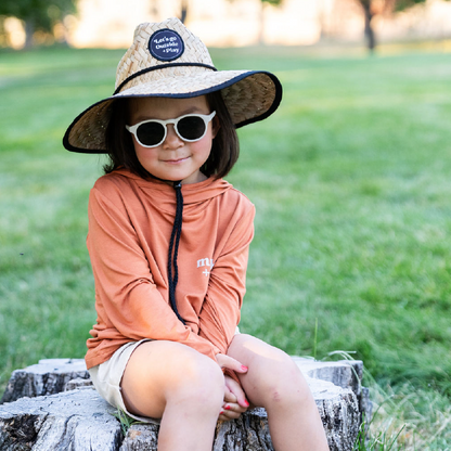 Girl outdoors playing in Play Outside's bamboo ONE all weather adventure shirts