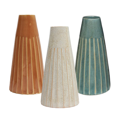 Ceramic tapered vases in burnt orange, white, and green colors.