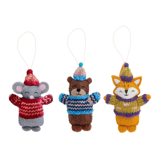 Felt ornaments of a mouse, a bear, and a fox in knitted sweaters and hats.