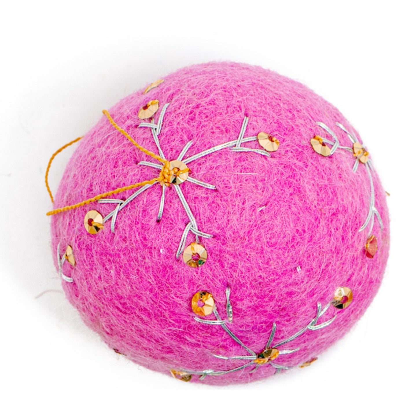 A round, bright pink felt ornament with white embroidery and gold sequin designs.