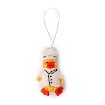 Felt ornament of a duck in a chef's hat and coat.