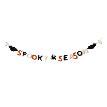 Felt garland that says "Spooky Season" in orange, black, and white letters with a black spider between the words and a bat and ghost on the ends.