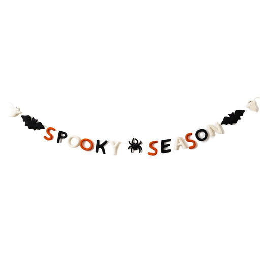 Felt garland that says "Spooky Season" in orange, black, and white letters with a black spider between the words and a bat and ghost on the ends.