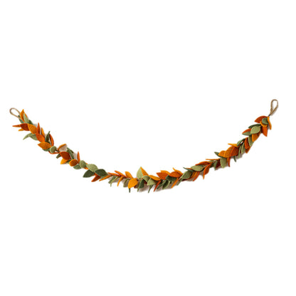 Felt garland of leaves in orange and green hanging.