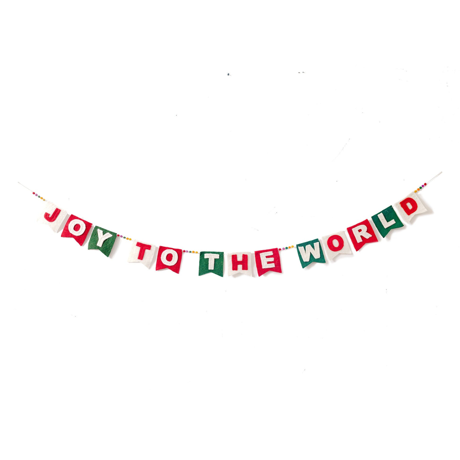 Felt garland spelling out Joy to the World in red and white letters on small dovetail flags in white, red, and green.