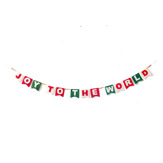 Felt garland spelling out Joy to the World in red and white letters on small dovetail flags in white, red, and green.