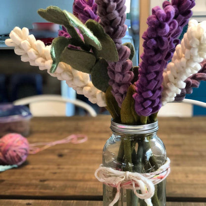 Felt Lavender flowers in purple, light purple, and white in a glass jar vase.