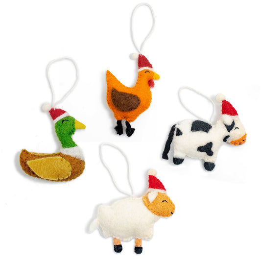 Felt ornaments of a duck, a chicken, a cow, and a sheep in Santa hats.
