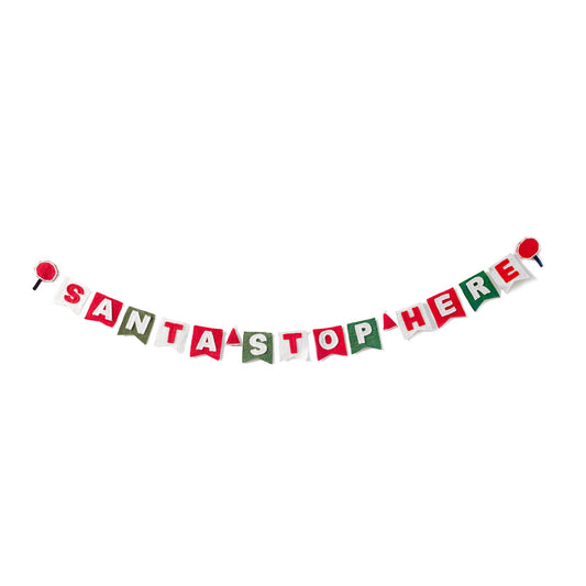 Felt garland spelling out Santa Stop Here in red and white letters on small dovetail flags in white, red, and green.