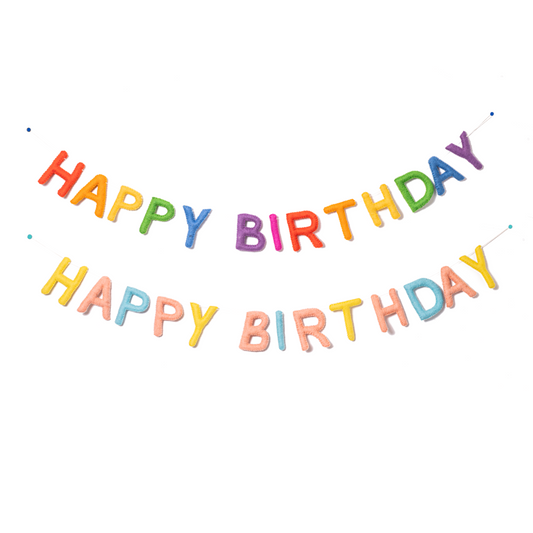Two felt garlands spelling Happy Birthday. The top one in bright classic rainbow colors. The one below in pastel yellow, pink, and blue colors.