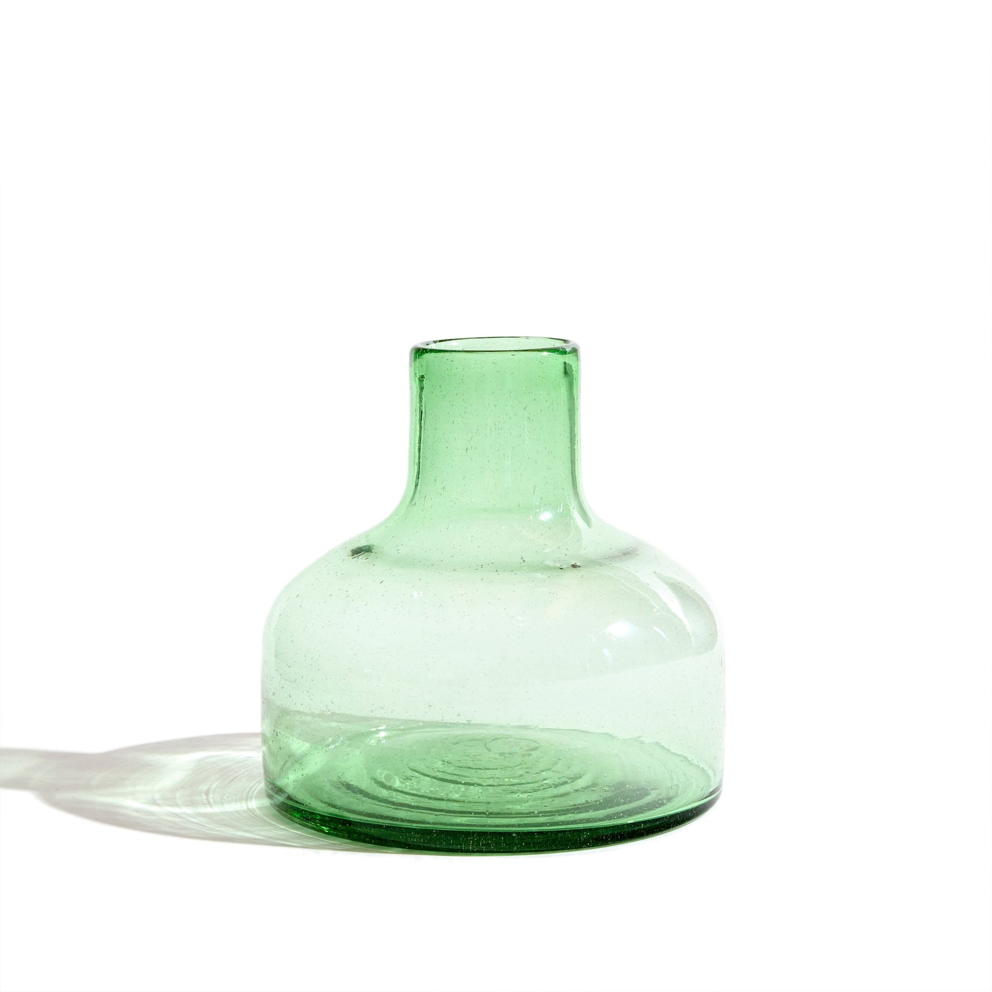 Short green glass vase.