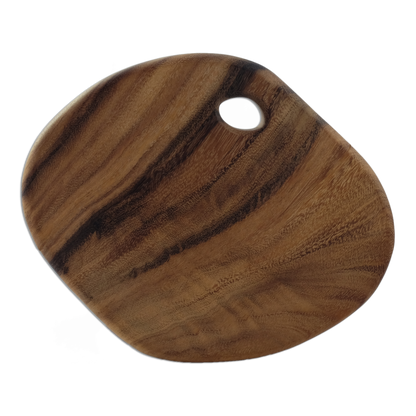 Brown wood round cutting board.