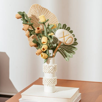 Blush and yellow felt Bellflowers in white vase with other various felt flowers.