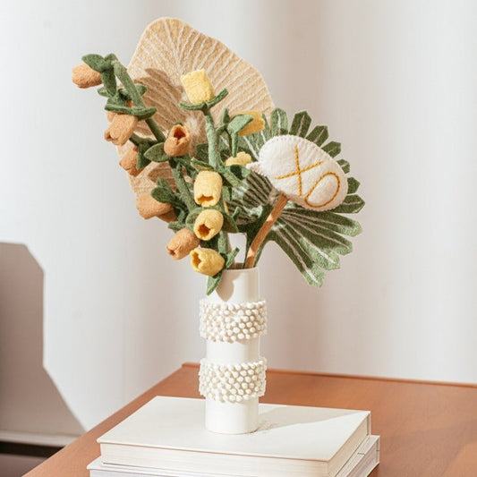 Blush and yellow felt Bellflowers in white vase with other various felt flowers.