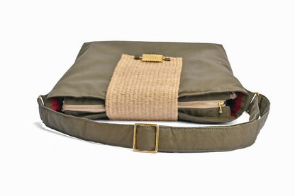 Flat top view of Partial olive green bag with sisal details and cloth strap.