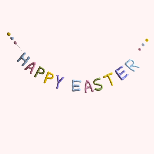 Handmaid felt garland that reads Happy Easter with easter eggs on the end | Global Goods Partners
