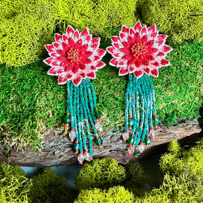 Pair of dahlia design earrings in red, yellow, green, and brown.