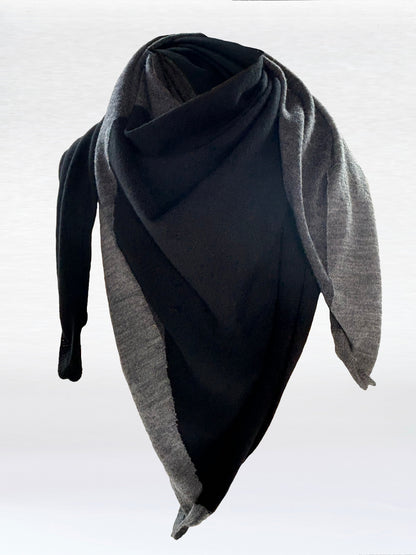 Scarf in black, charcoal, and light grey shaped as if wrapped around a mannikin.