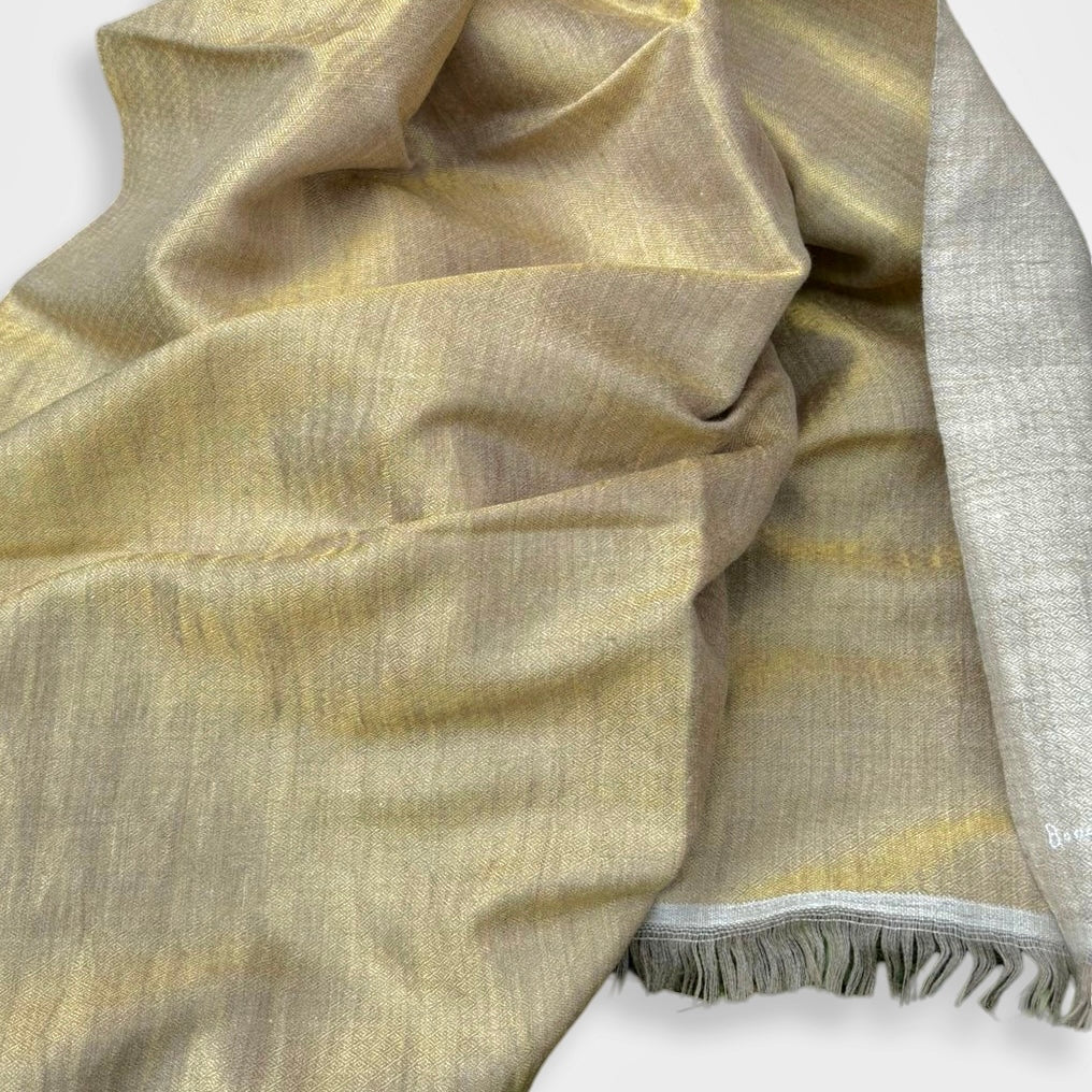 Gold and taupe wrap on white background.