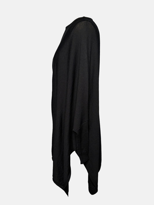 Side view of Black drapey boatneck sweater.