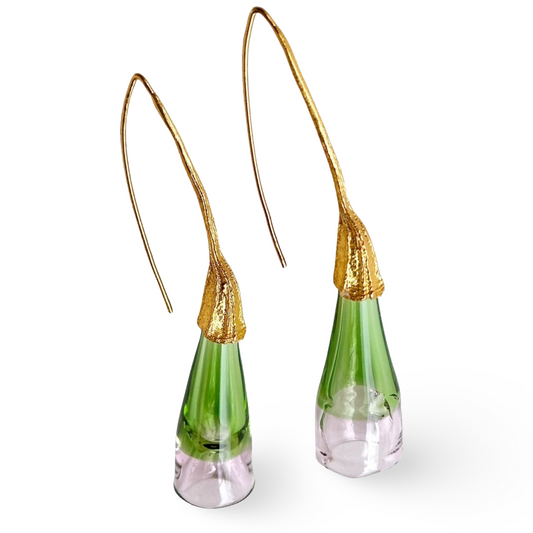 Pair of green and pale pink glass earrings with gold colored findings.