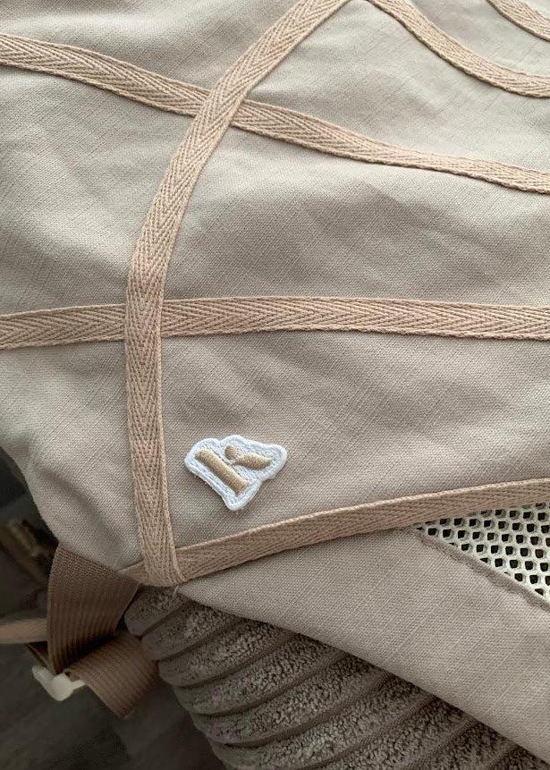 Closeup of The Corset Carrier Latte fabric.