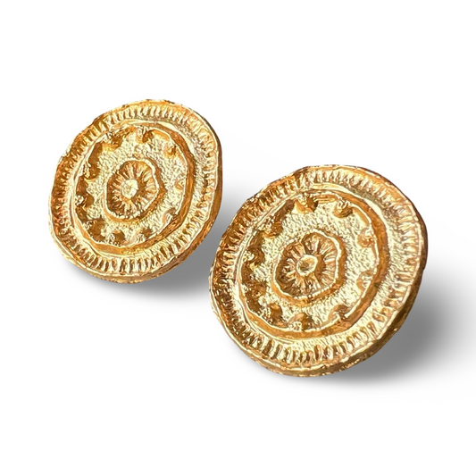 Pair of gold mandala earrings.