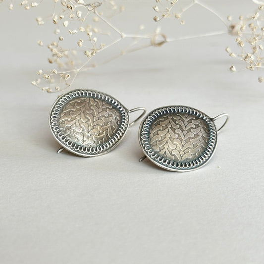 Pair of silver earrings