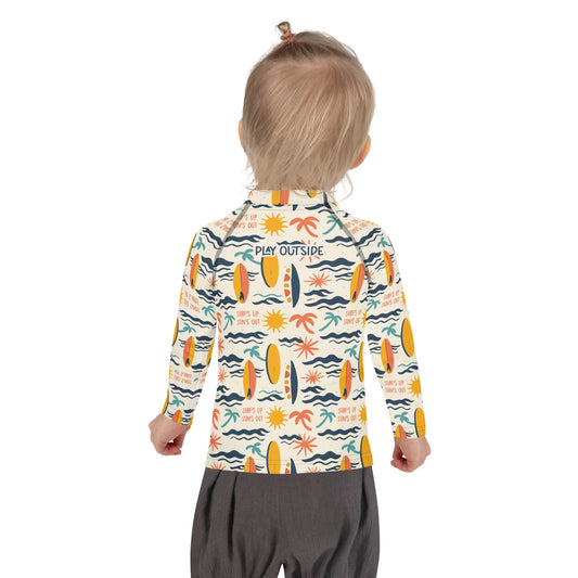 A playful surfboard and wave-themed rash guard for kids, made with sustainable fabric for ultimate sun protection.