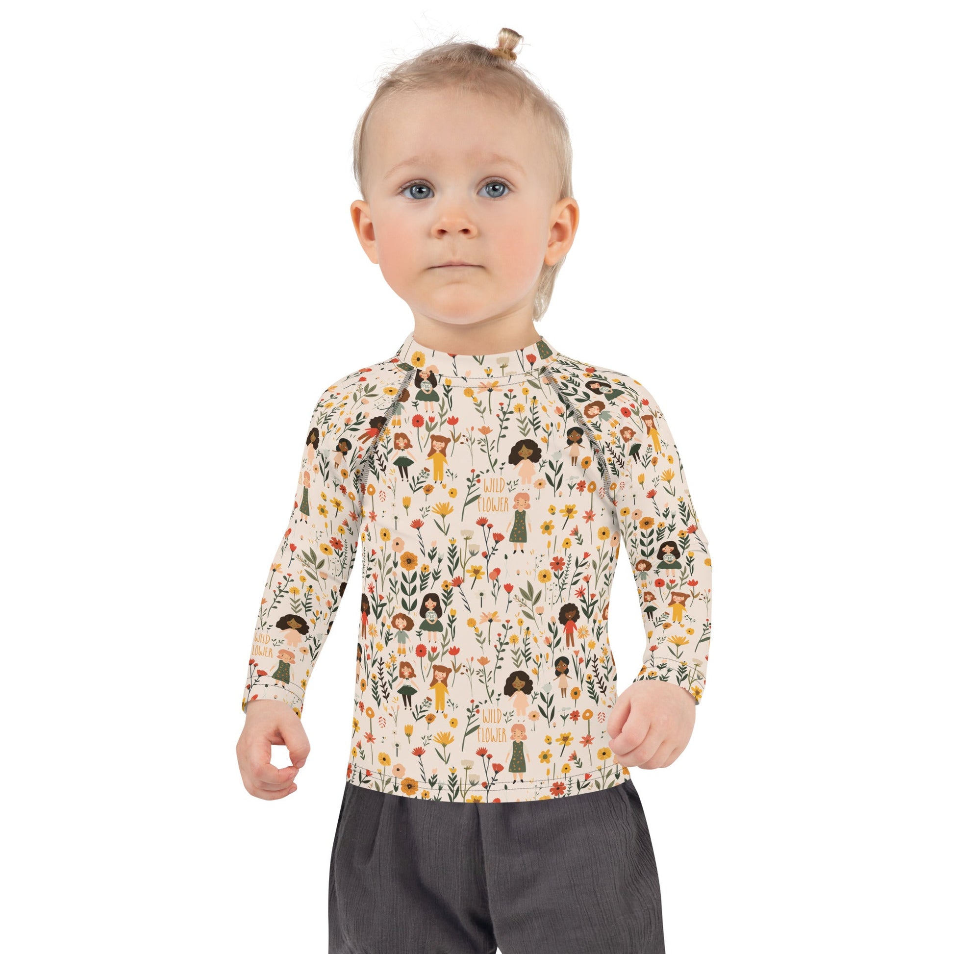 A kids’ rash guard featuring detailed wildflower patterns, perfect for protecting sensitive skin while enjoying the outdoors.